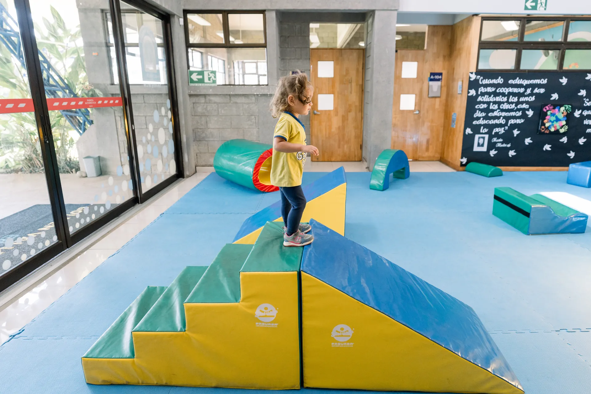 Montessori guide observing and supporting a child's developmental progress